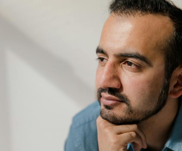 Close-up of a person with eyes closed in a calm meditative state.